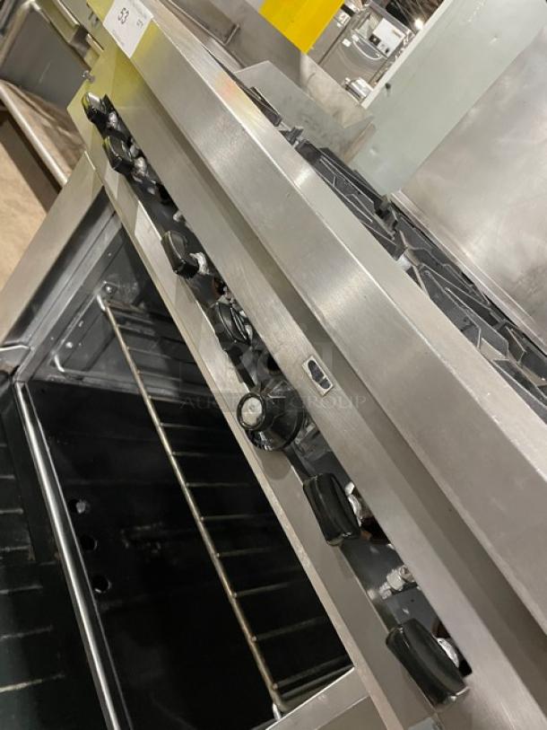 Sunfire by Garland stainless steel 6 burner range/oven with U.S. Range salamander broiler. Model SX626, on casters.