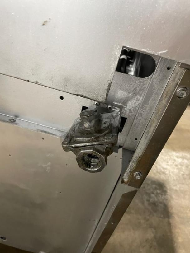 Back of Sunfire SX-6-26 stainless steel range/oven combo, showing part of the gas fitting.