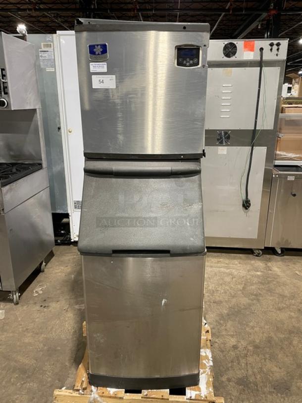 Manitowoc stainless steel ice machine/bin combo, model IY0524A161, in good condition. Air-cooled, 115V, with legs.