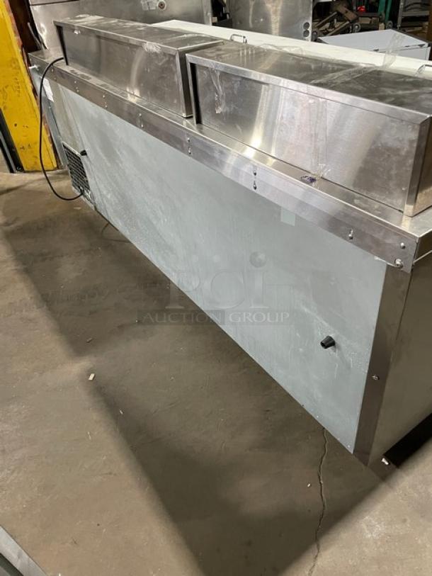 Continental RA93N30M stainless steel refrigerated prep table with cutting board, poly-coated rack, and on casters, 115V.