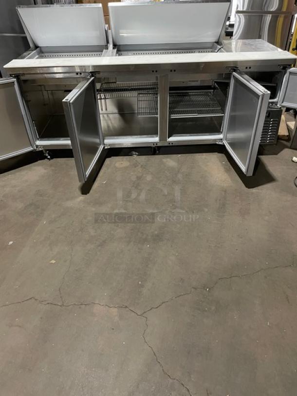 Continental RA93N30M stainless steel 3-1/2 door prep table with cutting board, poly-coated rack. On casters, good condition.