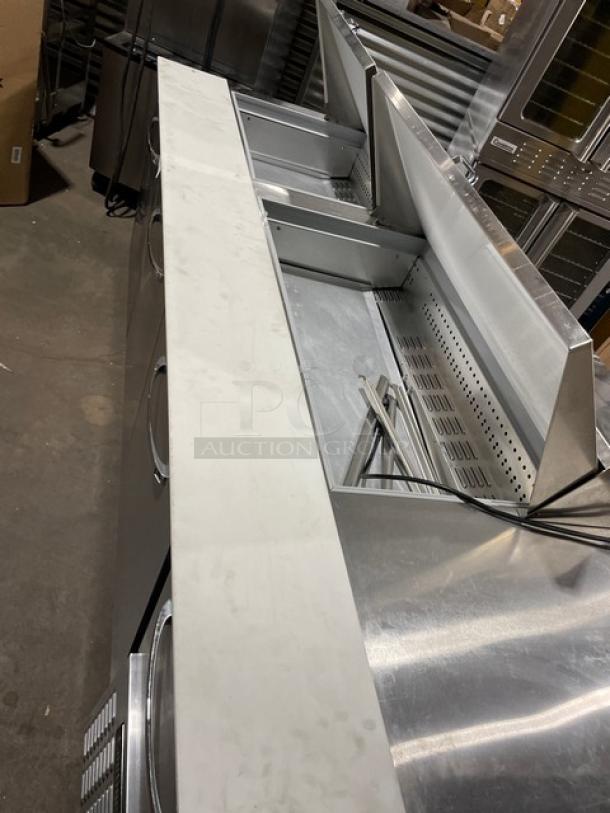Continental RA93N30M Bain Marie prep table with cutting board, poly-coated wire rack, 3-1/2 doors, stainless steel, on casters.