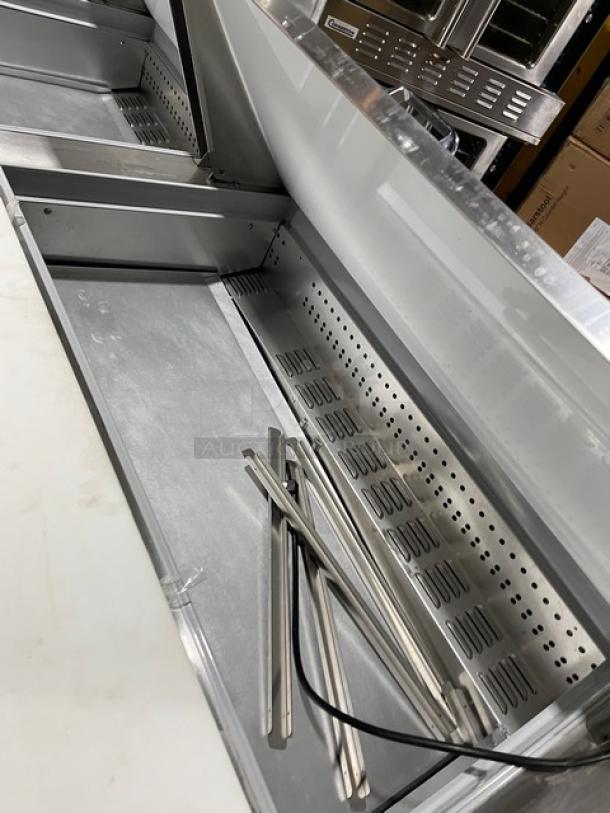 Continental stainless steel refrigerated bain marie prep table, Model RA93N30M, with poly-coated rack and cutting board.