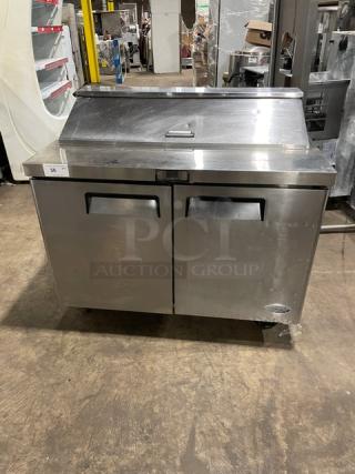 Atosa MSF8302 stainless steel 2-door refrigerated prep table on casters, poly coated rack, minor wear. Model MSF8302 SN: MSF8302150621C4003.