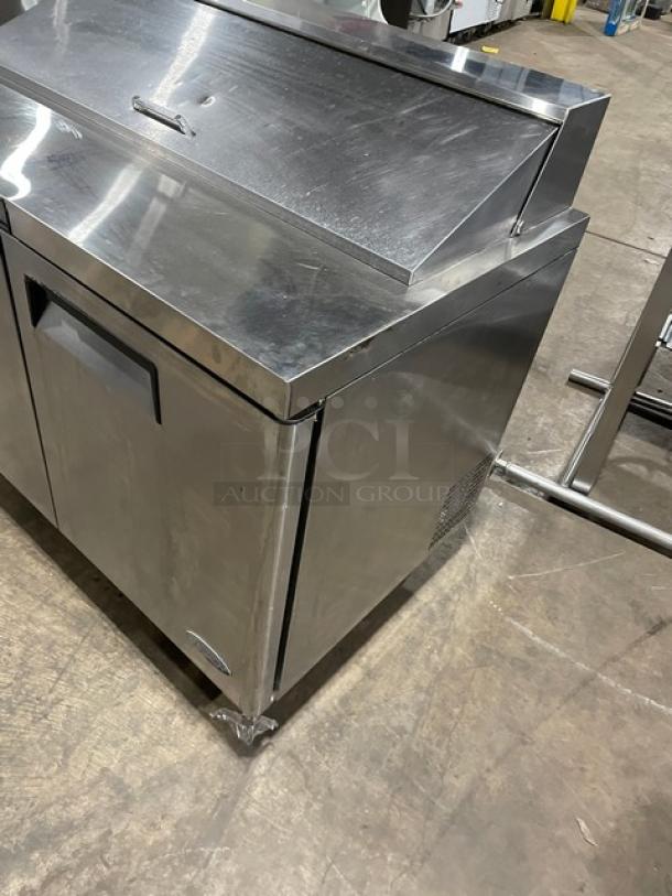 Atosa stainless steel refrigerated prep table, model MSF8302. Features 2 doors, poly-coated rack, on casters.