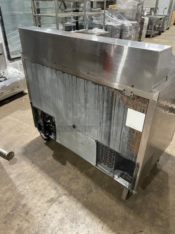 Atosa MSF8302 stainless steel 2-door refrigerated prep table, used condition, on casters, with poly-coated wired rack.