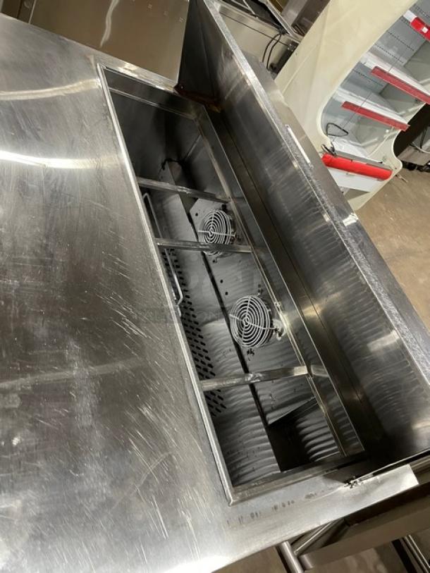 Atosa MSF8302 2-door refrigerated prep table, stainless steel, poly-coated rack, on casters, excellent condition.