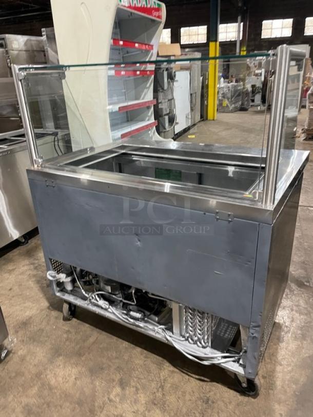 Atosa MSF8306 stainless steel refrigerated prep table with sneeze guard, poly-coated rack, and casters. 115V.