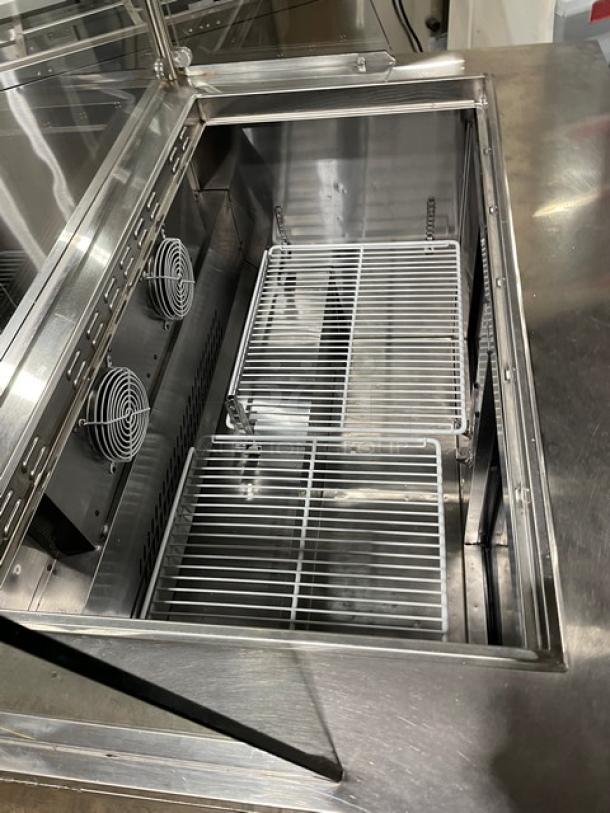 Atosa MSF8306 stainless steel refrigerated prep table with sneeze guard, poly coated rack, and casters. 115V.