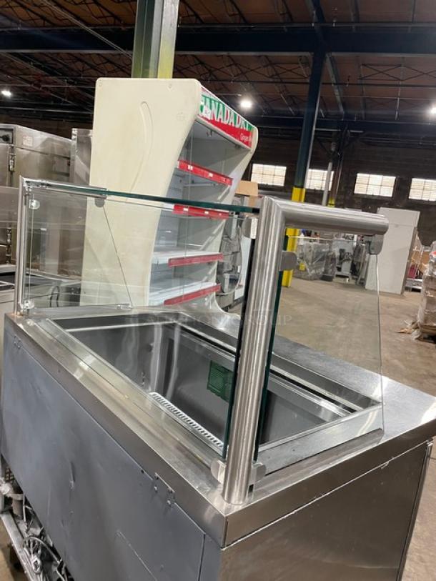 Atosa MSF8306 commercial stainless steel 2-door refrigerated prep table with sneeze guard, poly-coated rack, on casters.