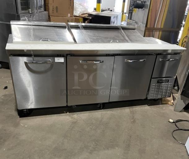 Continental RA93N30M Stainless Steel 3.5 Door Refrigerated Bain Marie Prep Table with cutting board, poly rack, on casters.