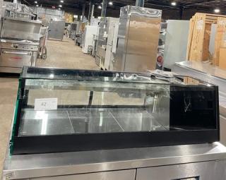 Turbo Air refrigerated sushi merchandiser, black, stainless steel interior, rear sliding doors, SN: H2SAS50D1024.