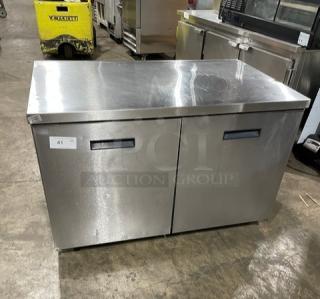 Randell 9302-7 stainless steel 2-door worktop refrigerator, flat-top, on casters, 115V, model number visible, pre-owned.