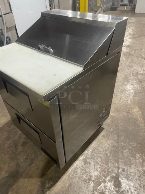 True TSSU-27-08D-2 stainless steel refrigerated prep table, 2 drawers, cutting board, on casters, 115V, excellent condition.