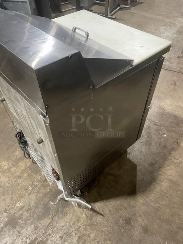 True TSSU-27-08D-2 refrigerated prep table with stainless steel, two drawers, cutting board, and casters. Model TSSU2708D2.