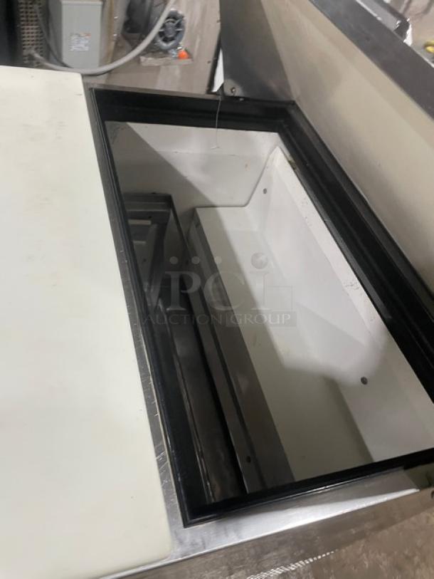 True TSSU-27-08D-2 refrigerated prep table, stainless steel, 2 drawers, cutting board, bain marie style, on casters.