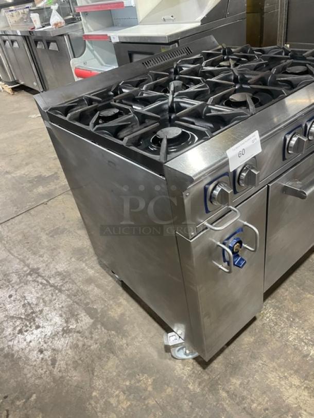 Electrolux commercial stainless steel 6 burner range with static oven, cast iron burners, and wired oven rack on casters.