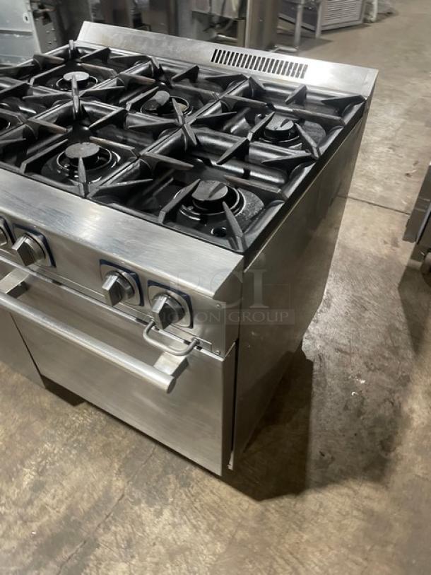 Electrolux commercial stainless steel 6-burner gas range and static oven combo, featuring cast iron burners, wired rack, and casters.
