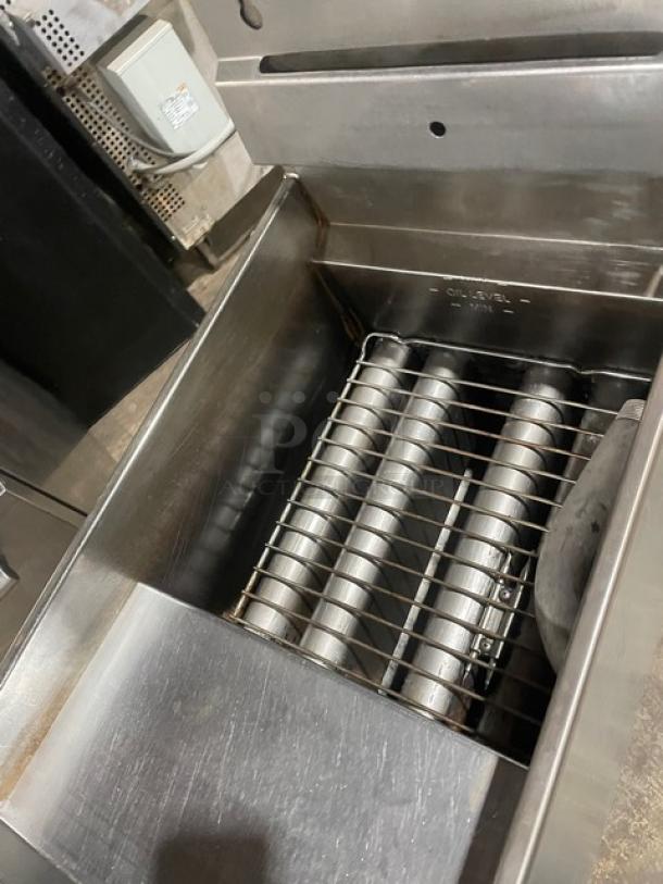 Pitco 45C stainless steel deep fat fryer, 42 lb. capacity, natural gas, with back splash and basket hanger, on legs.