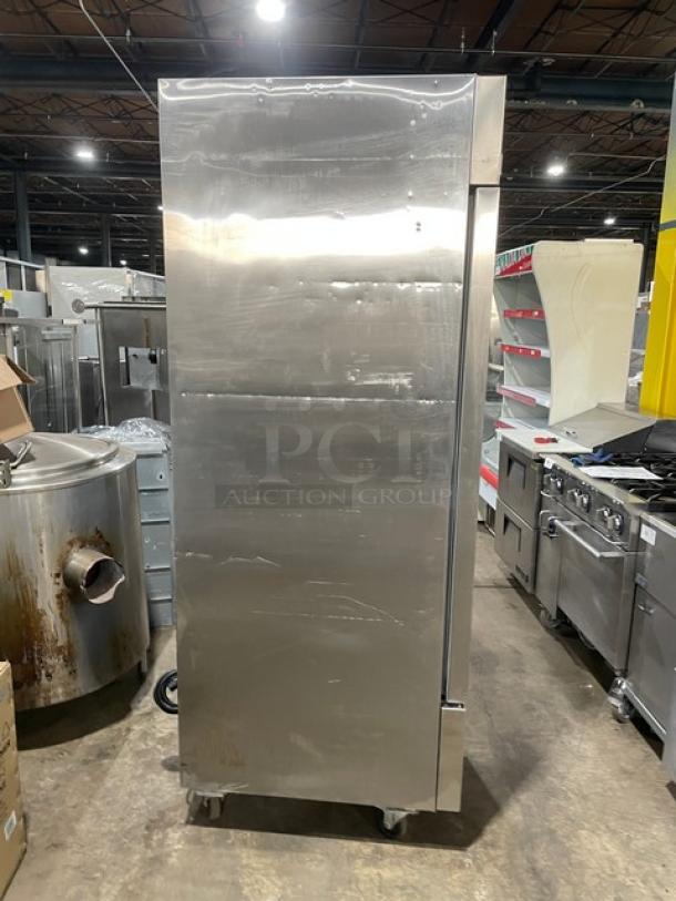 Arctic Air AR23E stainless steel reach-in refrigerator, Energy Star certified, with poly-coated wired rack and casters.