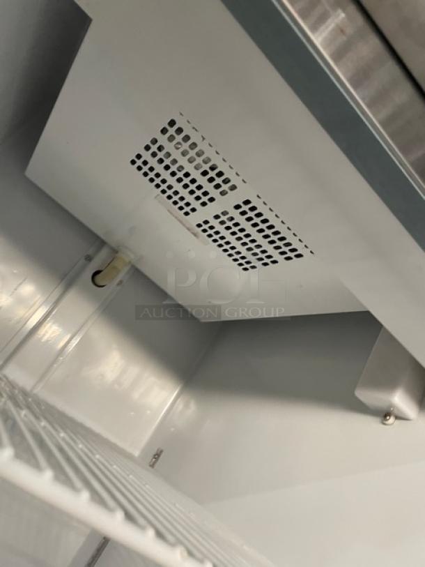 Arctic Air AR23E stainless steel single door refrigerator interior with poly-coated wired rack, Energy Star certified.