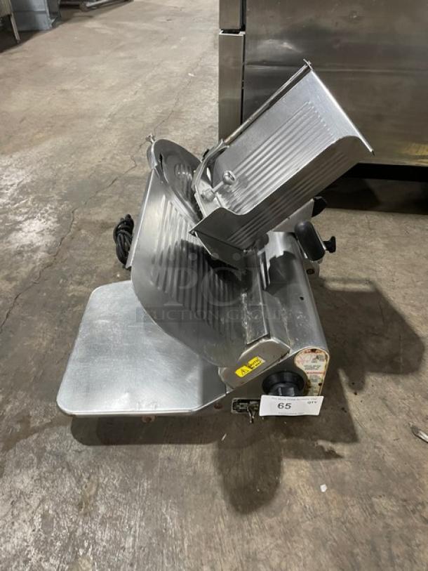 Globe Model 500L electric deli slicer on legs. Heavy-duty, stainless steel, used condition. Serial: 882440.