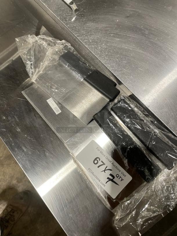 Brand new Winco DSC-2 stainless steel dough scraper with black grip handle, clear packaging, auction tag visible.