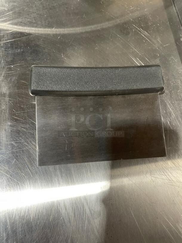 Brand new Winco DSC2 stainless steel dough scraper with black grip handle, commercial grade, high-quality finish.