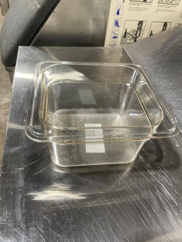Winco SP7604 clear polycarbonate food pan, 1/6-size, 4" deep, brand new condition, on metal surface.