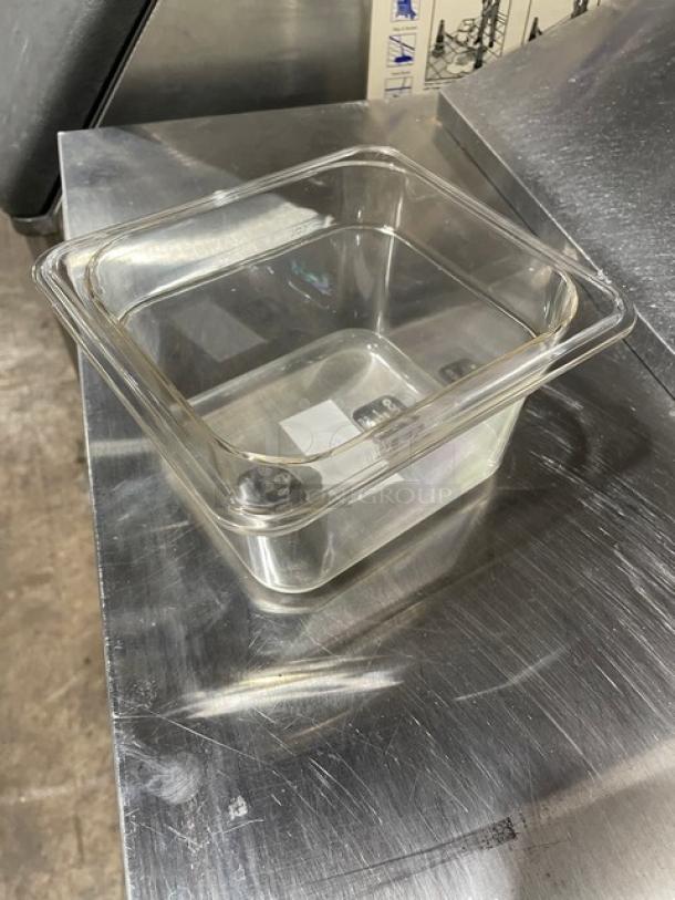 BRAND NEW Winco SP7604 1/6-Size 4" Deep Clear Polycarbonate Food Pan, commercial-grade, ideal for kitchens.