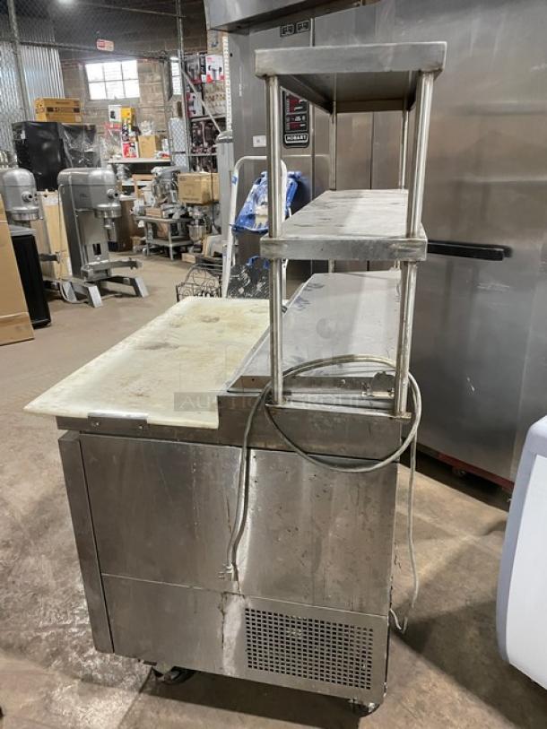Turbo Air Super Deluxe refrigerated prep table, model TPR-44SD, with cutting board, double overhead shelf, and chrome rack.