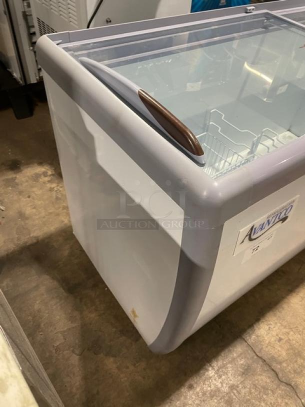 Avantco 70" flat-top freezer, model 360DFF20HCL, with double glass sliding doors, poly-coated basket, on casters.