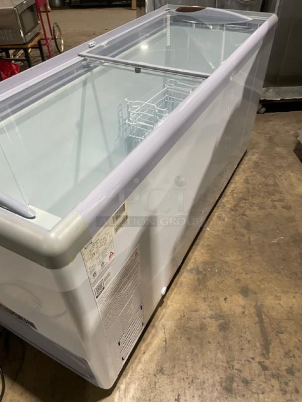 Avantco 70" commercial display freezer, model 360DFF20HCL, with double glass sliding doors, poly coated wire basket, on casters.