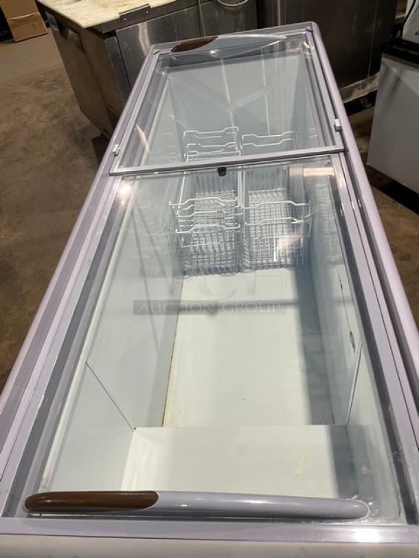 Avantco 70" Commercial Ice Cream Display Freezer, Model 360DFF20HCL, with double glass sliding doors and wire basket, on casters.