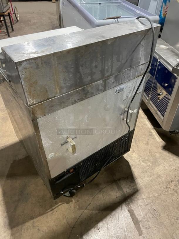 Avantco SCL Series stainless steel prep table, model 178SCL1, with single door, on casters, and visible wear.
