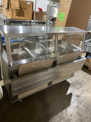 Piper Products stainless steel electric heated buffet counter, model 4HF, with 4 wells, sneeze guard, foldable trays, and single shelf base.