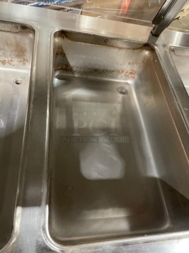Piper Products 4HF stainless steel electric heated buffet with sneeze guard, 4 wells, foldable tray slides, good condition.