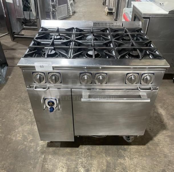 Electrolux commercial stainless steel 6-burner range and static oven combo with cast iron burners, wired oven rack, on casters.