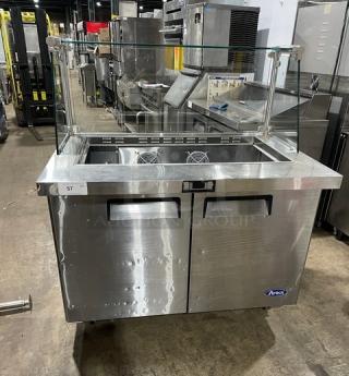 Atosa 2-door stainless steel refrigerated prep table, Model MSF8306, with sneeze guard and poly-coated rack, on casters.