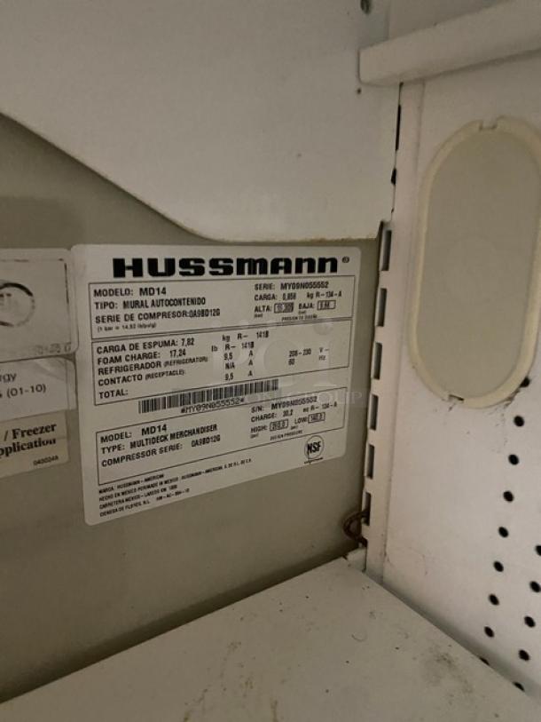 Hussmann Primo multi-tier refrigerated merchandiser, Model MD14, with pull-down curtain. Serial: MY09N055552. Powered by 208-230V.