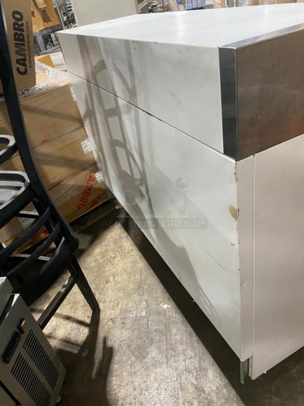 True TMC58 one-sided milk cooler, white and stainless steel, with poly coated wired rack. Model: TMC-58, SN: 4895573, 115V 1 Phase.