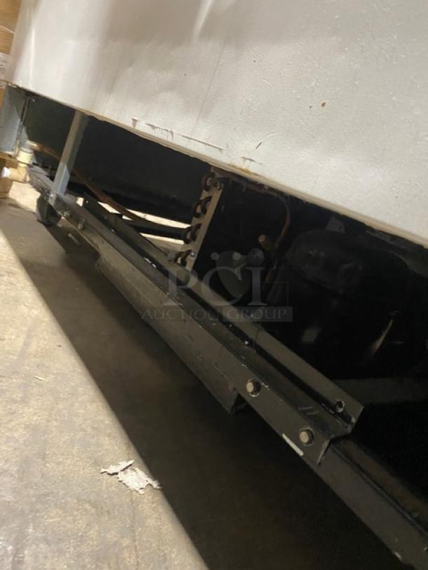 True TMC58 one-sided milk cooler, stainless steel finish, poly coated wired rack, model TMC-58 SN: 4895573, 115V 1 phase.