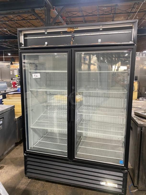True GDM-49F-LD commercial double glass door freezer, Energy Star certified, with poly-coated racks, on casters.