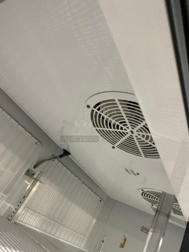 True Commercial Black Double Glass Swing Door Freezer, Model GDM49FLD; Energy Star certified, poly-coated wired rack.