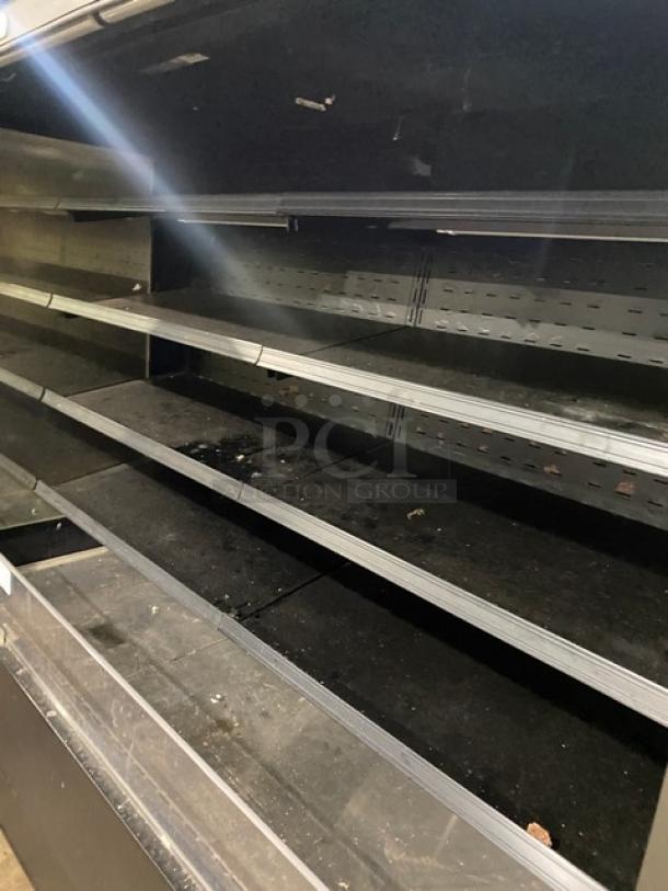 Federal Industries RSSM678SC5 refrigerated black multi-tier open display case. Used condition. Model details visible.