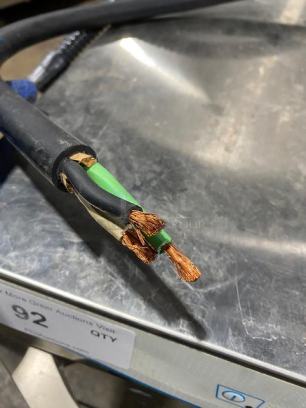 Veetsan VLAI1G4 dishwasher wiring detail. Exposed copper wires on stainless steel surface. Model: VLAI1G4.