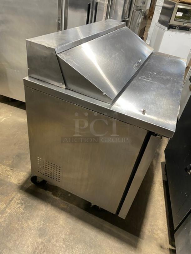 True TSSU-48-12 stainless steel refrigerated prep table, two doors, bain marie style, on casters, 115V, commercial use.