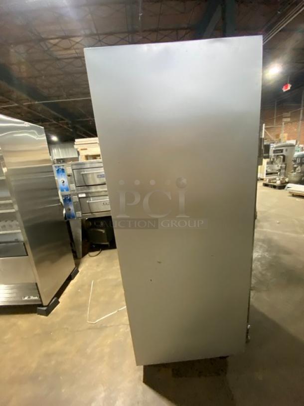 Traulsen G-Series stainless steel 2-door reach-in freezer on casters, Model G22010, Energy Star certified, 115V, side view.