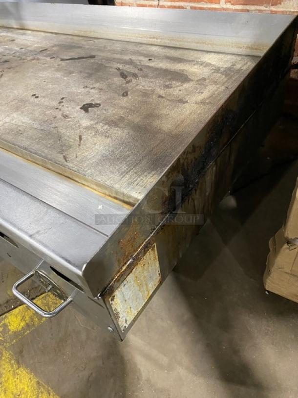 Vulcan stainless steel countertop flat griddle, natural gas, thermostatic control, back and side splash, on legs, used condition.