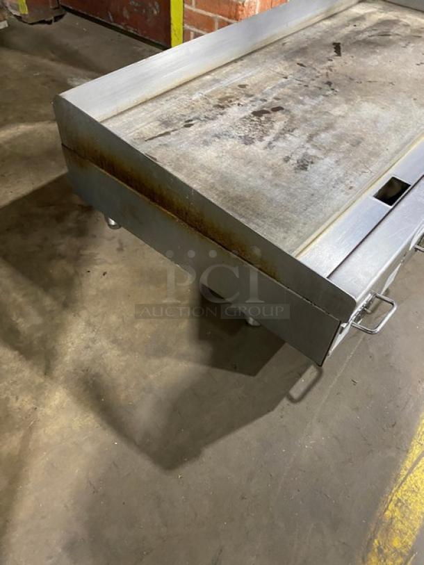 Vulcan commercial stainless steel gas griddle, thermostatic control, back and side splash, on legs, used condition.